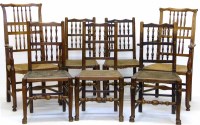 Lot 721 - Harlequin set of eight elm rush seated chairs.