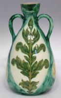 Lot 244 - Della Robbia twin handled vase.