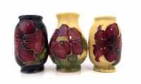 Lot 251 - Three Moorcroft miniature vases.
