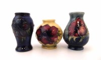 Lot 253 - Three Moorcroft miniature vases.