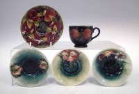 Lot 255 - Moorcroft cup and four saucers.