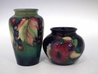 Lot 256 - Moorcroft leaf and berry vase and one other.