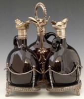 Lot 368 - Silver plated three bottle decanter set.