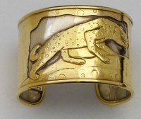 Lot 397 - gold and silver cuff/bracelet.