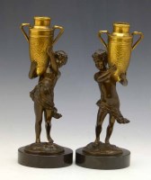 Lot 603 - Pair of gilt and patinated water carriers.