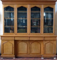Lot 667 - Pale oak bookcase on base.