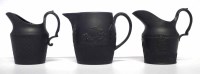 Lot 133 - Three Black Basalt Jugs