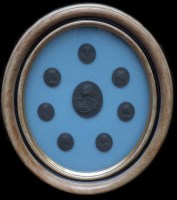 Lot 141 - Eight black basalt plaques framed.