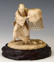 Lot 248 - Japanese ivory okimono of a farmer and chicks.