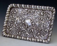 Lot 274 - Embossed silver dressing table tray.
