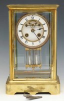 Lot 640 - Four glass mantel clock, pendulum and key.