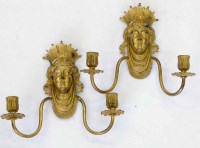 Lot 652 - Pair of gilt metal neo classical female mask wall sconces