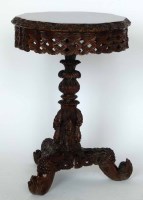Lot 689 - Burmese hardwood tripod table