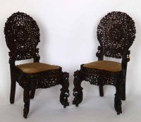 Lot 692 - Pair of Burmese carved hardwood chairs