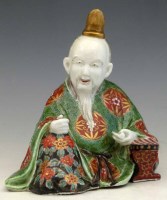 Lot 233 - 19thC Kutani figure of a scribe