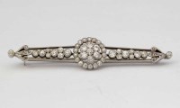 Lot 265 - 18ct white gold and platinum diamond bar brooch, circa 1920.