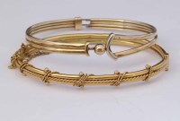 Lot 268 - 18ct gold hinged bangle and a 9ct bangle (2).