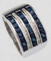 Lot 290 - 18K white gold broad band ring set with five