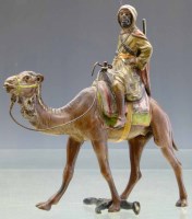 Lot 393 - Cold painted bronze camel and rider, possibly