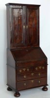 Lot 414 - Figured walnut veneered small bureau bookcase