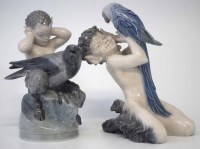 Lot 238 - Two Royal Copenhagen Fauns, modelled with pet