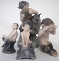 Lot 239 - Four Royal Copenhagen Fauns, one modelled riding
