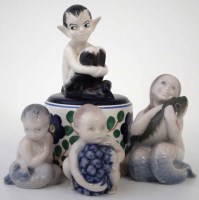 Lot 240 - Royal Copenhagen Faun, modelled perched on a