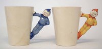 Lot 242 - Two Clarice Cliff Gnome ware beakers, with pixie