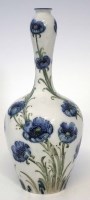 Lot 265 - William Moorcroft, blue poppies bottle vase.