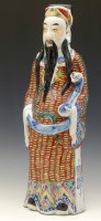 Lot 309 - Chinese figure of an imortal with incense houses.