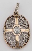 Lot 366 - Antique gold and diamond oval locket set with rose cut stones and a windowed back, overall length 43mm