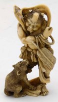 Lot 332 - Ivory figure man with monkey.
