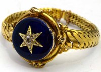 Lot 398 - Victorian gold bracelet locket set with diamonds and guilloche enamel on the hinged cover, diameter 3cm, gross weight 41.5g.