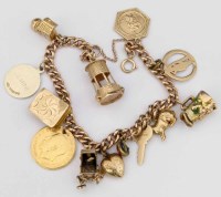 Lot 403 - 9ct gold charm bracelet, 39.4g gross.