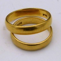 Lot 404 - Two 22ct gold wedding rings.