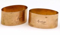 Lot 406 - Pair of 9ct gold oval napkin ring sir & madam 79.2.gross