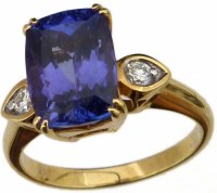 Lot 407 - Tanzanite and diamond ring.