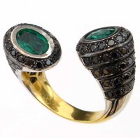 Lot 410 - Emerald and black diamond ring.