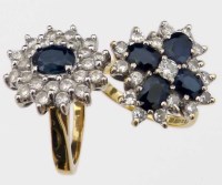 Lot 417 - Two sapphire and diamond cluster rings.