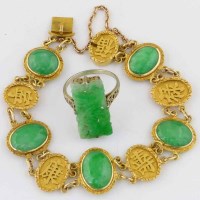 Lot 445 - Chinese 18k gold and jade bracelet and a jade ring.