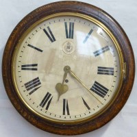 Lot 693 - RAF oak cased wall clock.