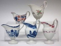 Lot 119 - Four Keeling (Factory X) helmet shaped cream jugs