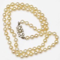 Lot 361 - String of pearls with diamond clasp.