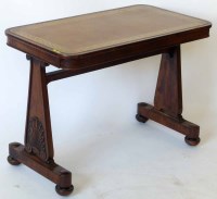 Lot 568 - Rosewood leather topped stretcher table.