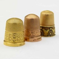 Lot 349 - Three gold thimbles, 17.1g.