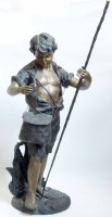 Lot 555 - Bronze figure of a fisher boy.