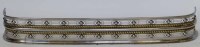 Lot 572 - Polished steel fender, Regency.