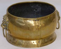 Lot 578 - Oval brass wine cooler with Lion mask handles.