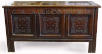Lot 650 - Oak coffer, late 17th century, the panelled top
