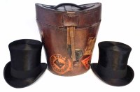 Lot 5 - Leather travel hat box containing two silk hats